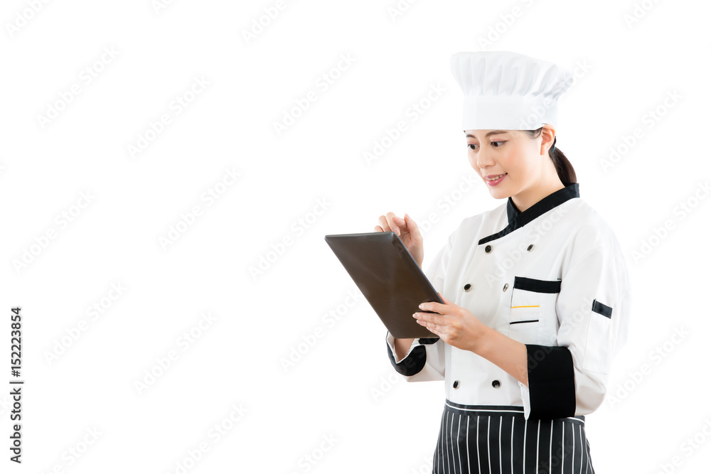 smiling asian woman chef using digital tablet smiling asian woman chef using digital tablet