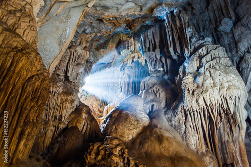 Limestone cave with light. photo