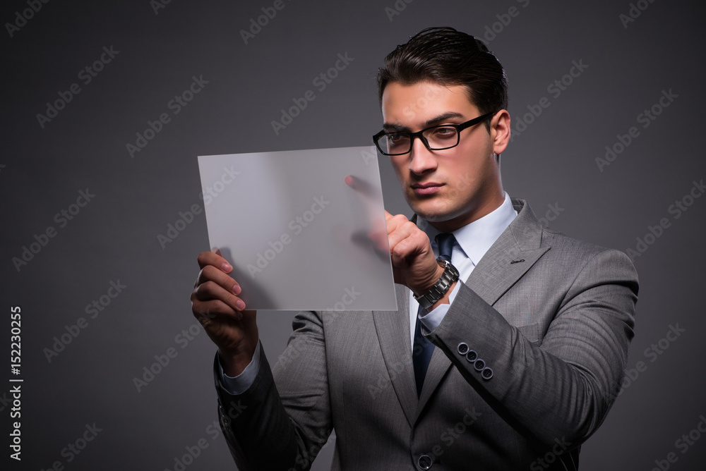 Handsome businessman working on tablet computer Handsome businessman working on tablet computer