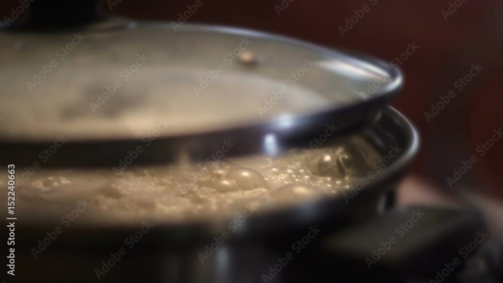 Mashed Potatoes boiling in pot in kitchen cafeteria Mashed Potatoes boiling in pot in kitchen cafeteria