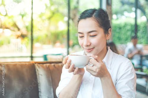 Young woman sitting in a coffee shop