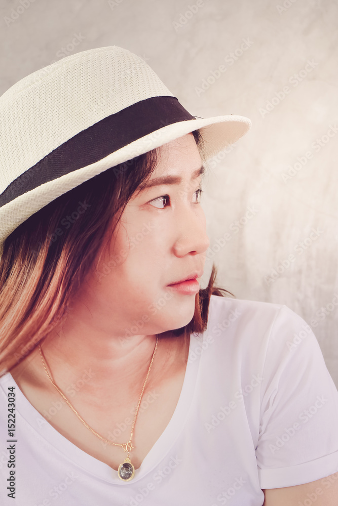 Close-up of face of young asian woman wearing hat lifestyle portrait Close-up of face of young asian woman wearing hat lifestyle portrait