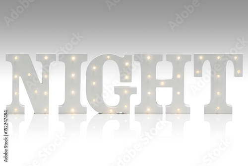 Illuminated Letters Spelling NIGHT Over Gradient Gray-White Background