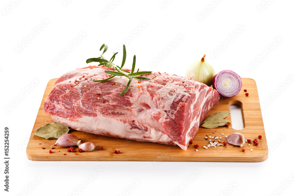 Fresh raw pork on cutting board on white background Fresh raw pork on cutting board on white background