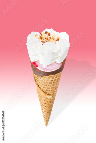 Strawberry ice cream cone with cream and almond stuffed with strawberry jam isolated on pink and white background (clipping path included)