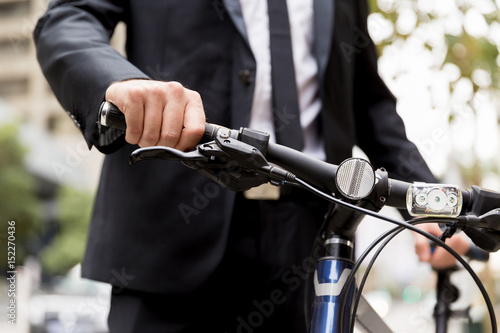 Young businessman with bike