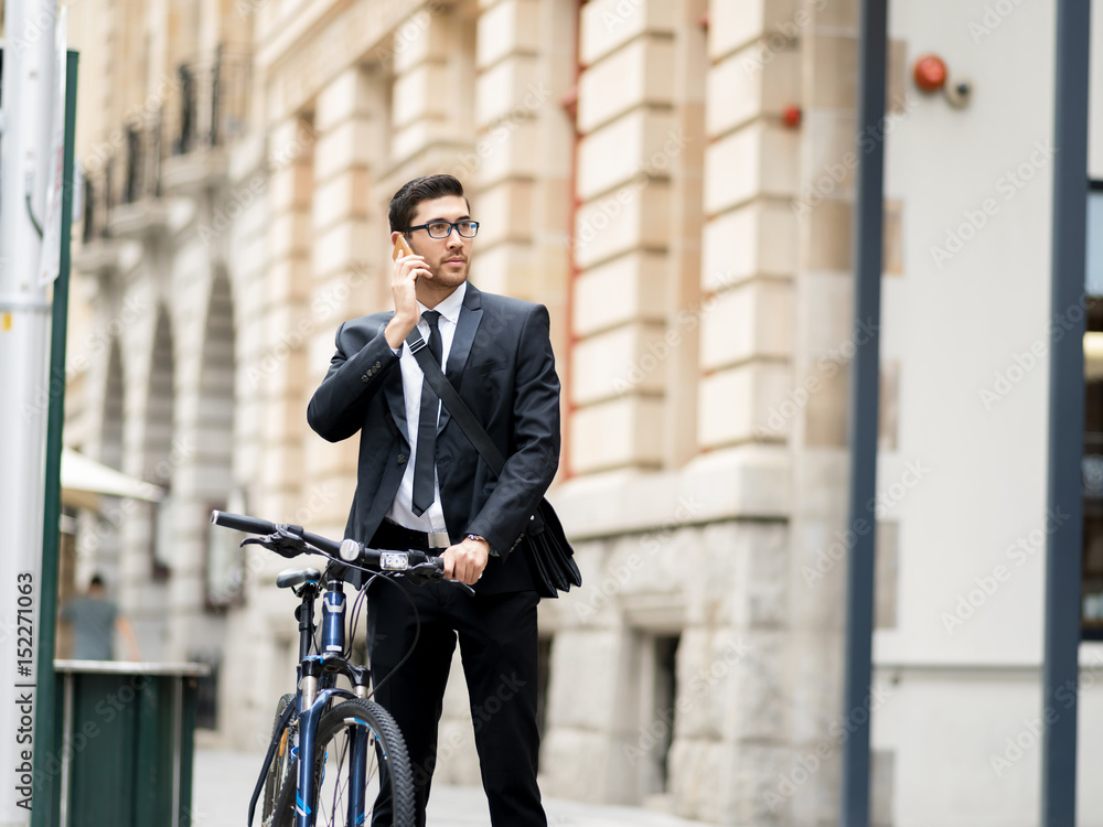 Young businessmen with a bike Young businessmen with a bike