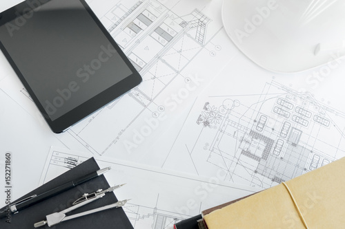 Construction equipment. Repair work. Drawings for building Architectural project, blueprint rolls and divider compass on table. Engineering tools concept with copy space.