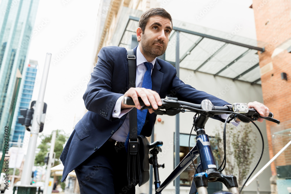 Young businessmen with a bike