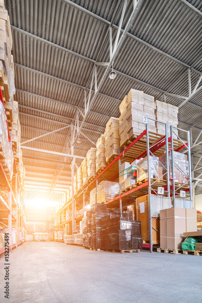 Fototapeta premium Long shelves with a variety of boxes and containers.