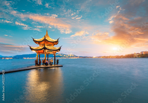 Fototapeta Naklejka Na Ścianę i Meble -  ancient pavilion of Hangzhou west lake at dusk, in China