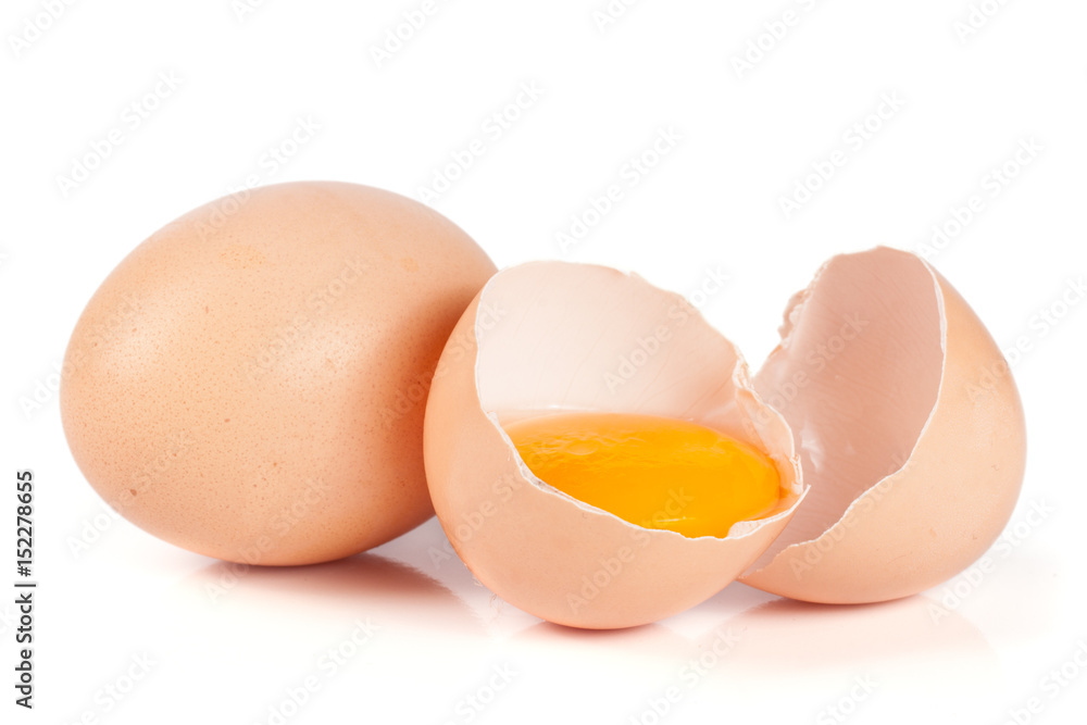 one brown egg and broken egg isolated on white background one brown egg and broken egg isolated on white background