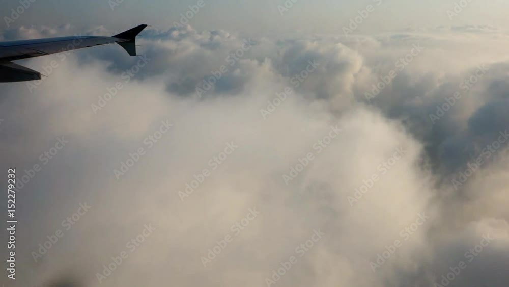 traveling over clouds in an airplane traveling over clouds in an airplane