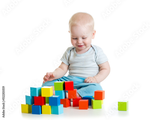 Kid building from toy block...