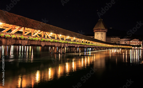Chapel Bridge and Water Tower at night with reflection on the lake, Lucerne, Switzerland