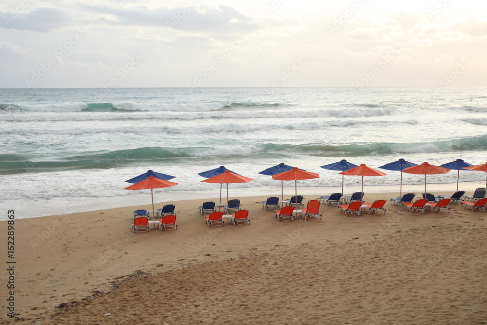 Beach chairs and umbrellas on beach Beach chairs and umbrellas on beach