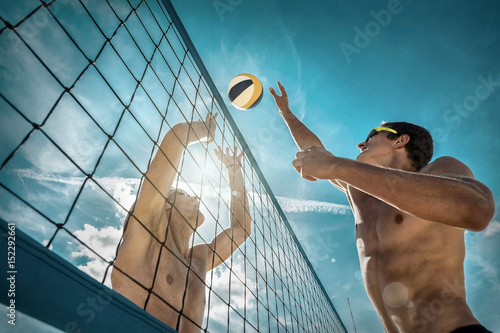 Beach Volleyball players in sunglasses under sunlight. Dynamic s