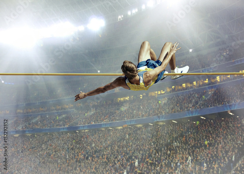 Athlete in action of high jump.