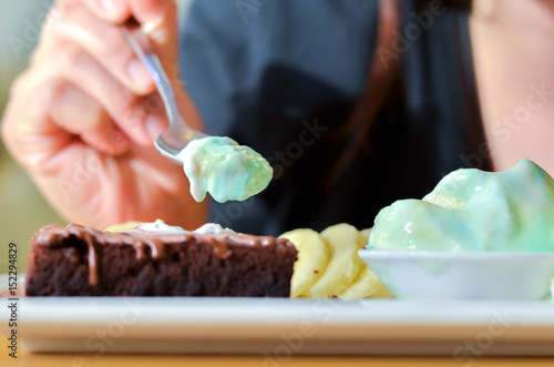 Delicious ice rainbow, brownie, cake, vanilla cream and banana in holiday.