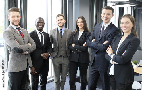 group of businesspeople standing together in office.