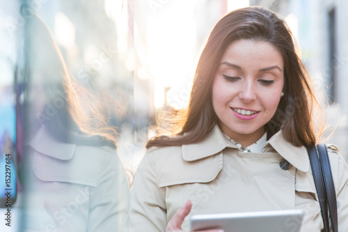 cheerful businesswoman using a tablet computer