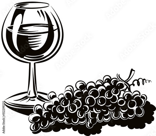 bunch of grapes ripe freshly picked and a glass of wine.