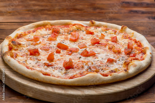 Pizza on a wooden background