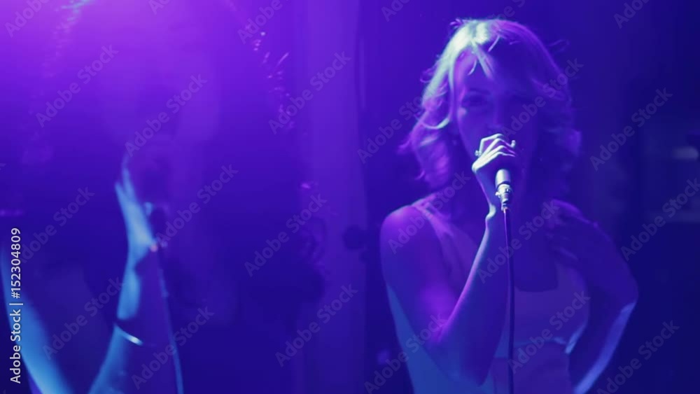 Beautiful charismatic two women singer performing at music event Beautiful charismatic two women singer performing at music event