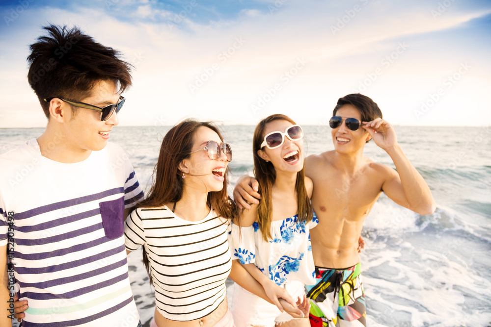 happy young group walking on the beach enjoy summer vacation happy young group walking on the beach enjoy summer vacation