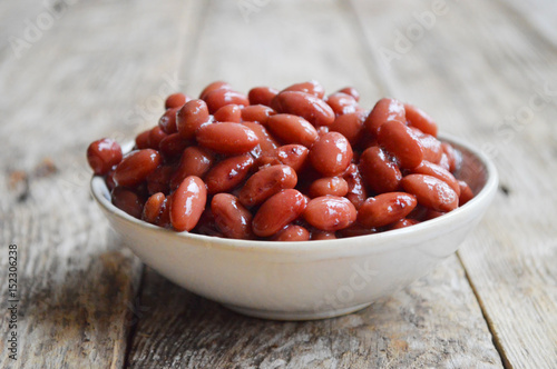 Canned red beans. Wooden background. Food Photo