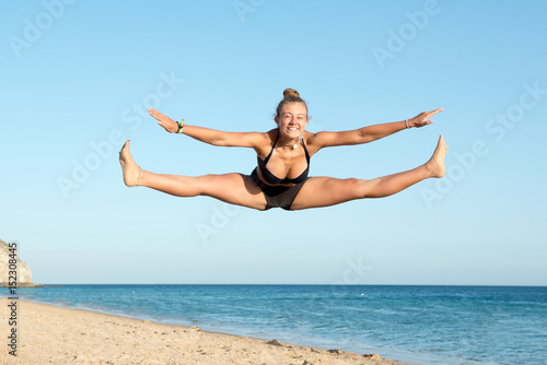 Girl jumping in the beach