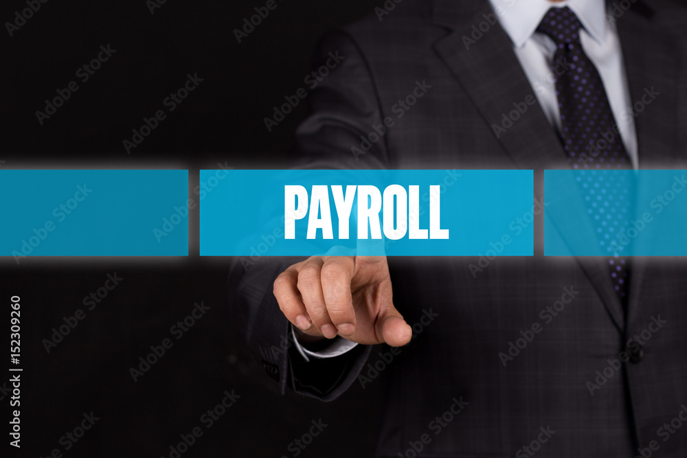 Hand pushing on a touch screen interface-PAYROLL button Hand pushing on a touch screen interface-PAYROLL button