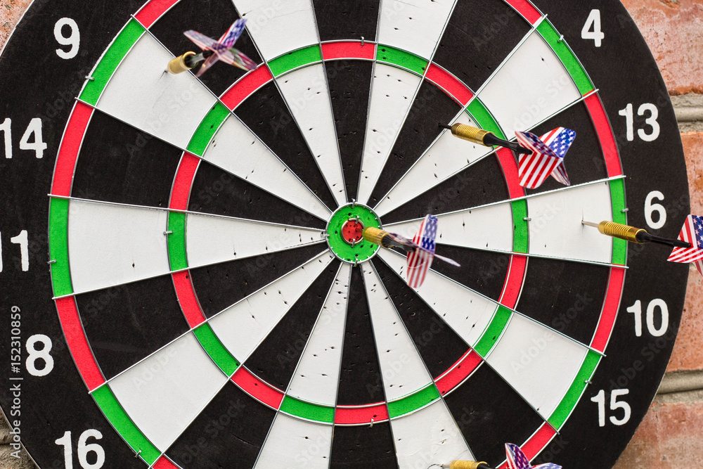 dart in bullseye on the target with many other Darts dart in bullseye on the target with many other Darts