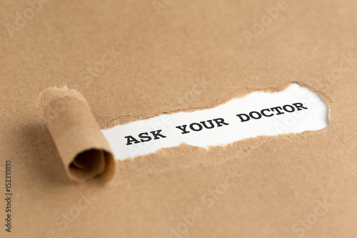 The text ASK YOUR DOCTOR appearing behind torn brown paper