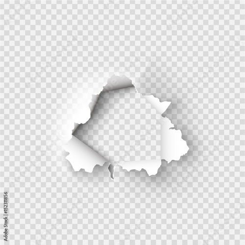 Holes torn in paper on transparent