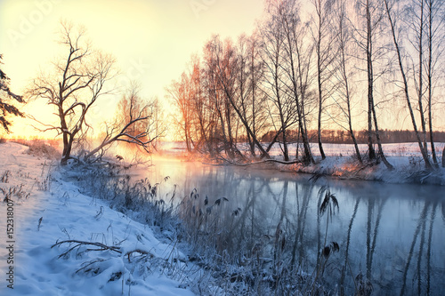 Winter landscape misty dawn on the winter river