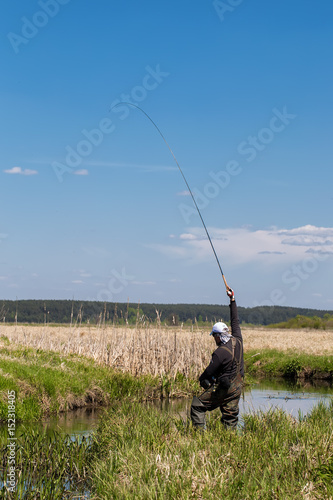 A man is catching a tenkara fishing