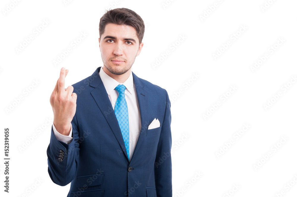 Serious young man crossing his fingers Serious young man crossing his fingers