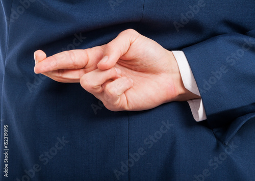 Closeup of man hand doing a cheating gesture