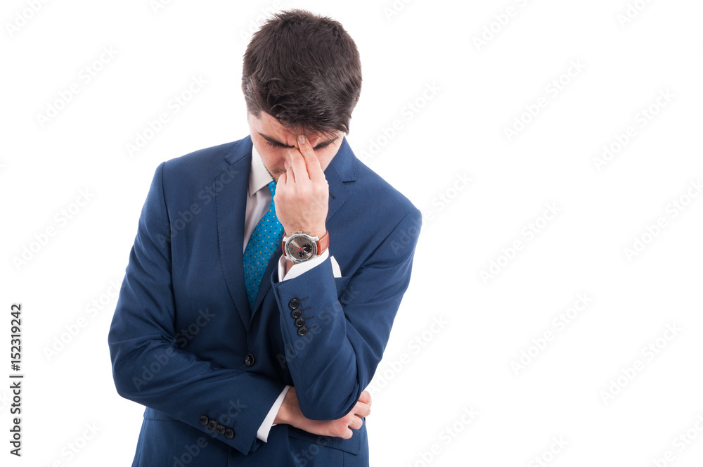 Tired salesman having strong headache at work Tired salesman having strong headache at work