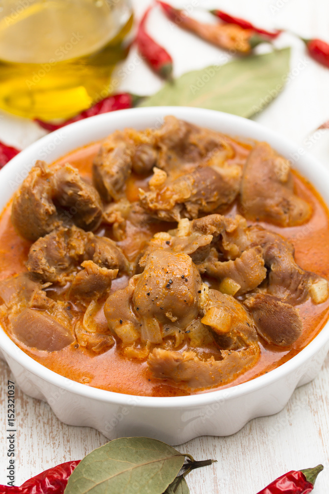 boiled chicken gizzards with vegetables on white bowl boiled chicken gizzards with vegetables on white bowl