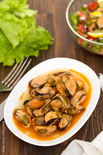 mussels in sauce on white dish