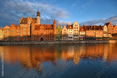 Long Embankment and Motlawa River in the Old Town of Gdansk, Poland at sunrise. Mariacka Gate on the left