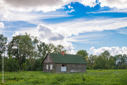 Small country farmhouse out on the field. Dobele, Latvia.