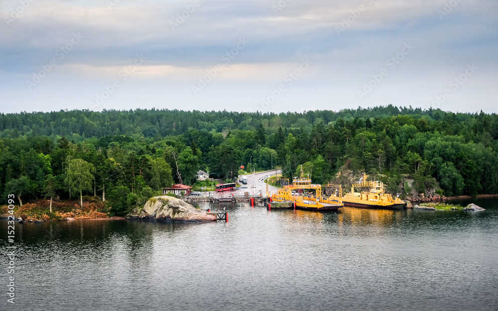 Turku, Finland, July 25 2015. Two car ferrys with landscape at summer evening in coastline, Finland Turku, Finland, July 25 2015. Two car ferrys with landscape at summer evening in coastline, Finland