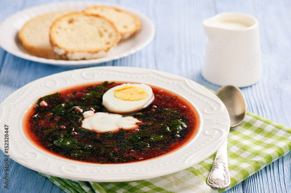 Homemade cold beetroot soup with egg.