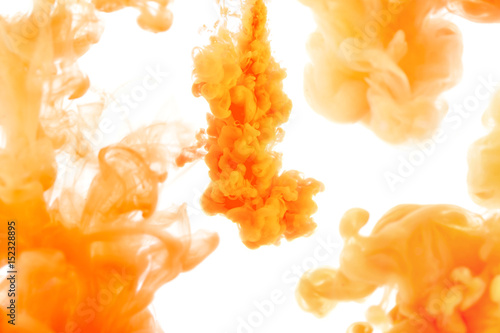 orange ink in water, abstract background