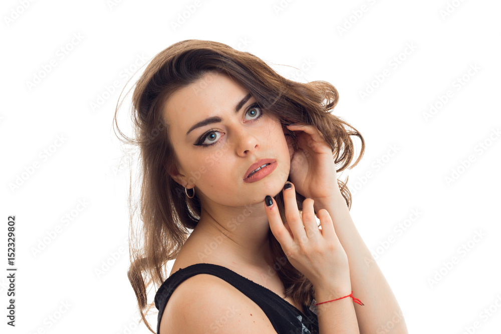 brunette woman with beautiful make up posing and looking aside brunette woman with beautiful make up posing and looking aside