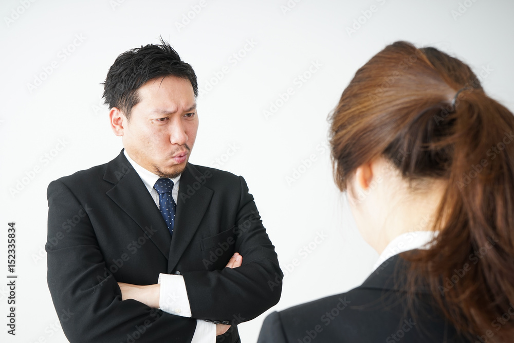 Boss angry with young business person Boss angry with young business person