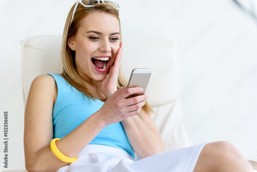 Trendy girl smiling while gesticulating wonderingly Trendy girl smiling while gesticulating wonderingly
